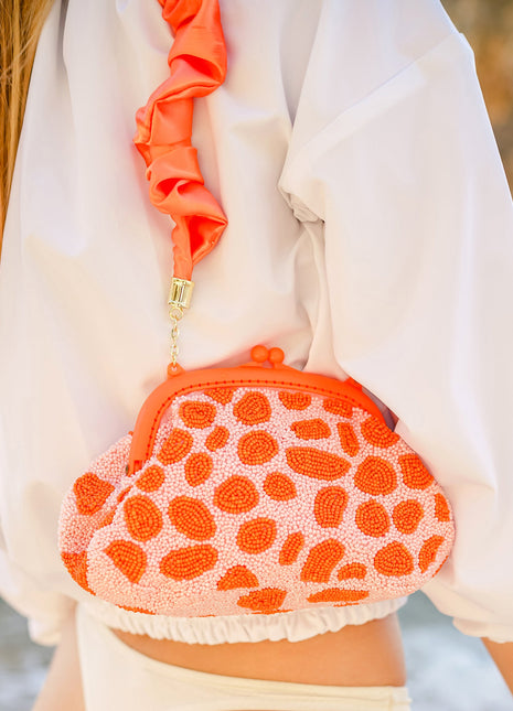 The Arnoldi Peachpuff Clutch Bag In Orange & Peach
