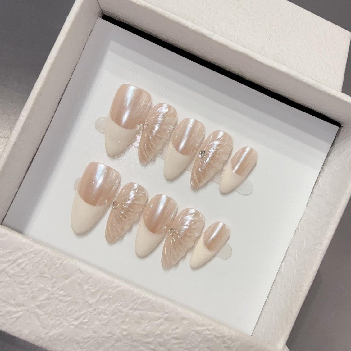 Set of beige nail art designs in a box