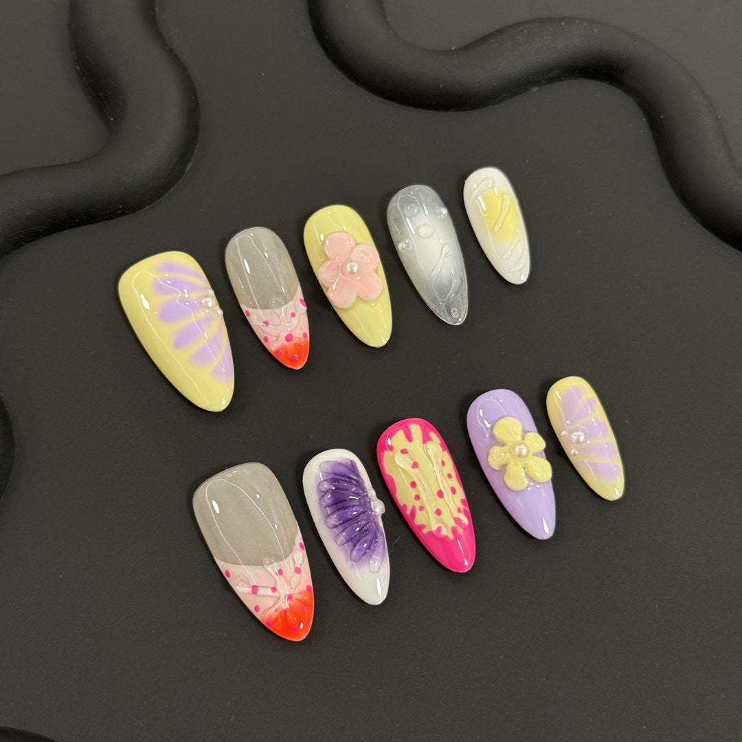 Colorful polly pocket hawaiian kawaii nail art designs on a black background