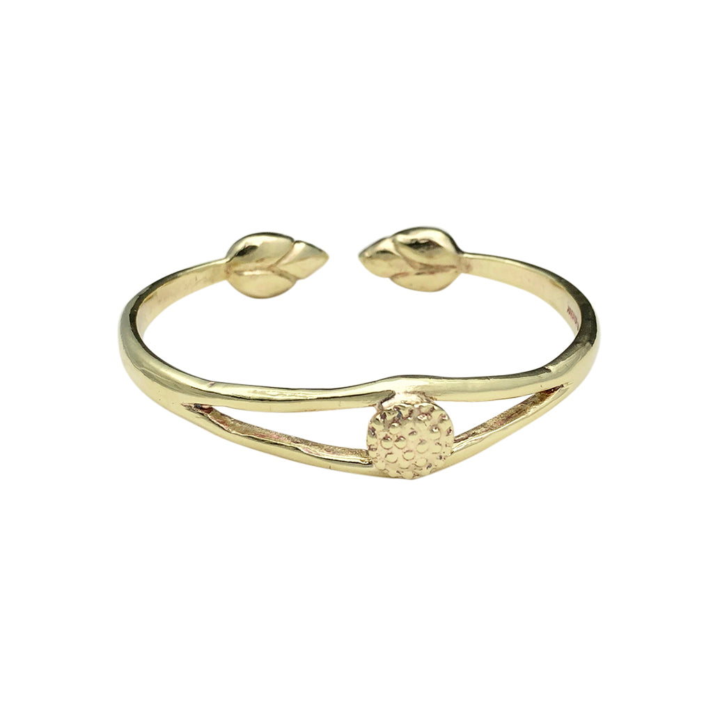 Gold bracelet with leaf designs on a white background